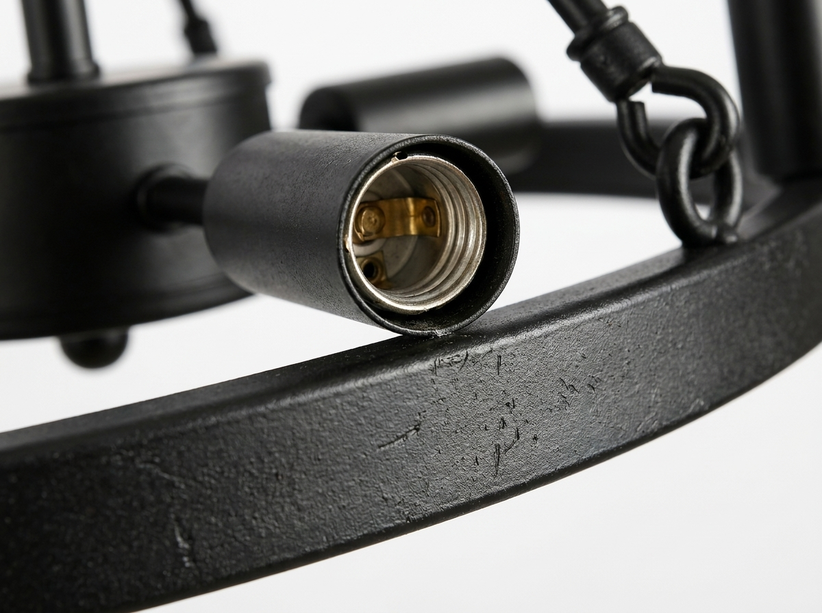 Close-up of the matte black iron frame and open bulb sockets