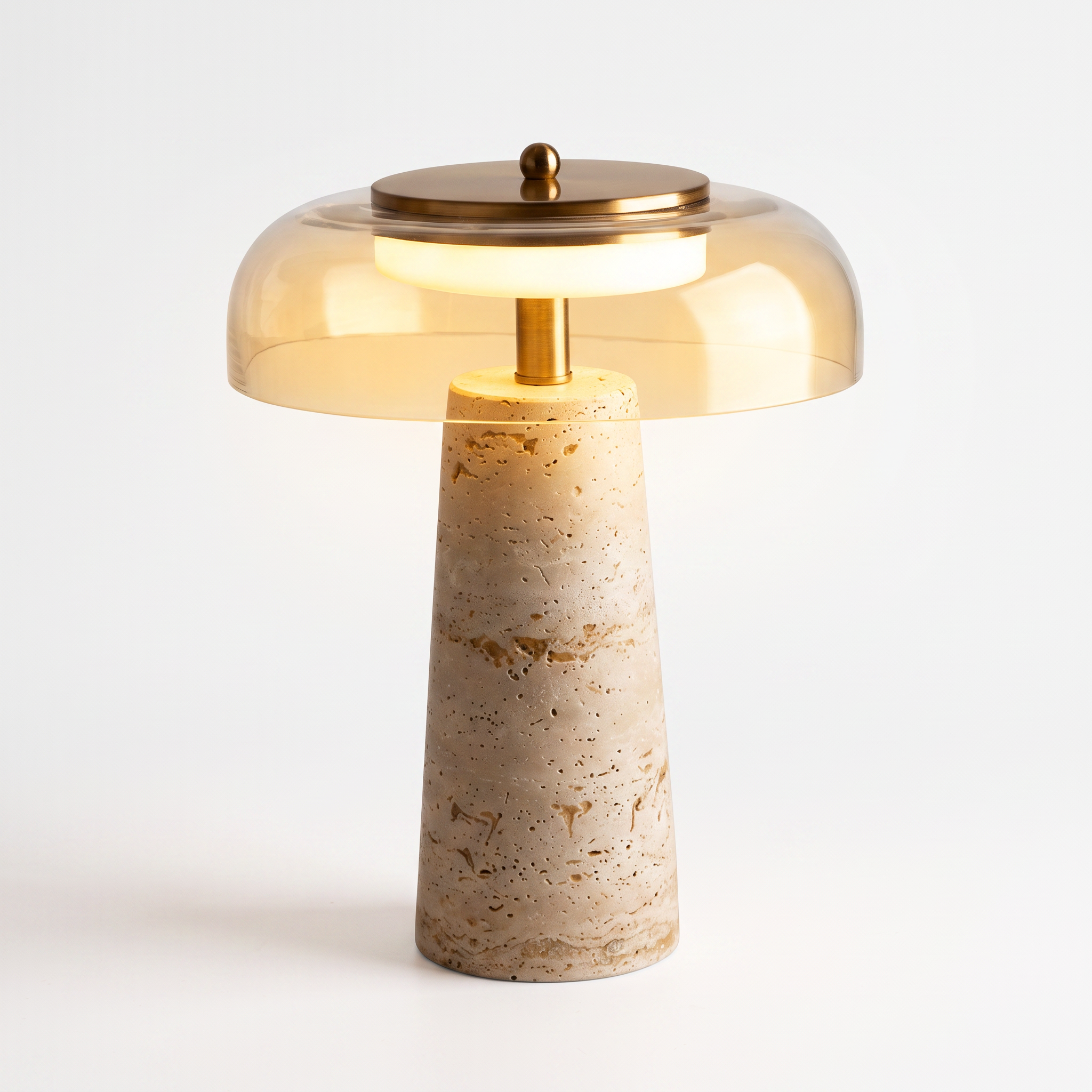 Mushroom Travertine Table Lamp, Clear glass shade, lit warm glow, premium pure white background